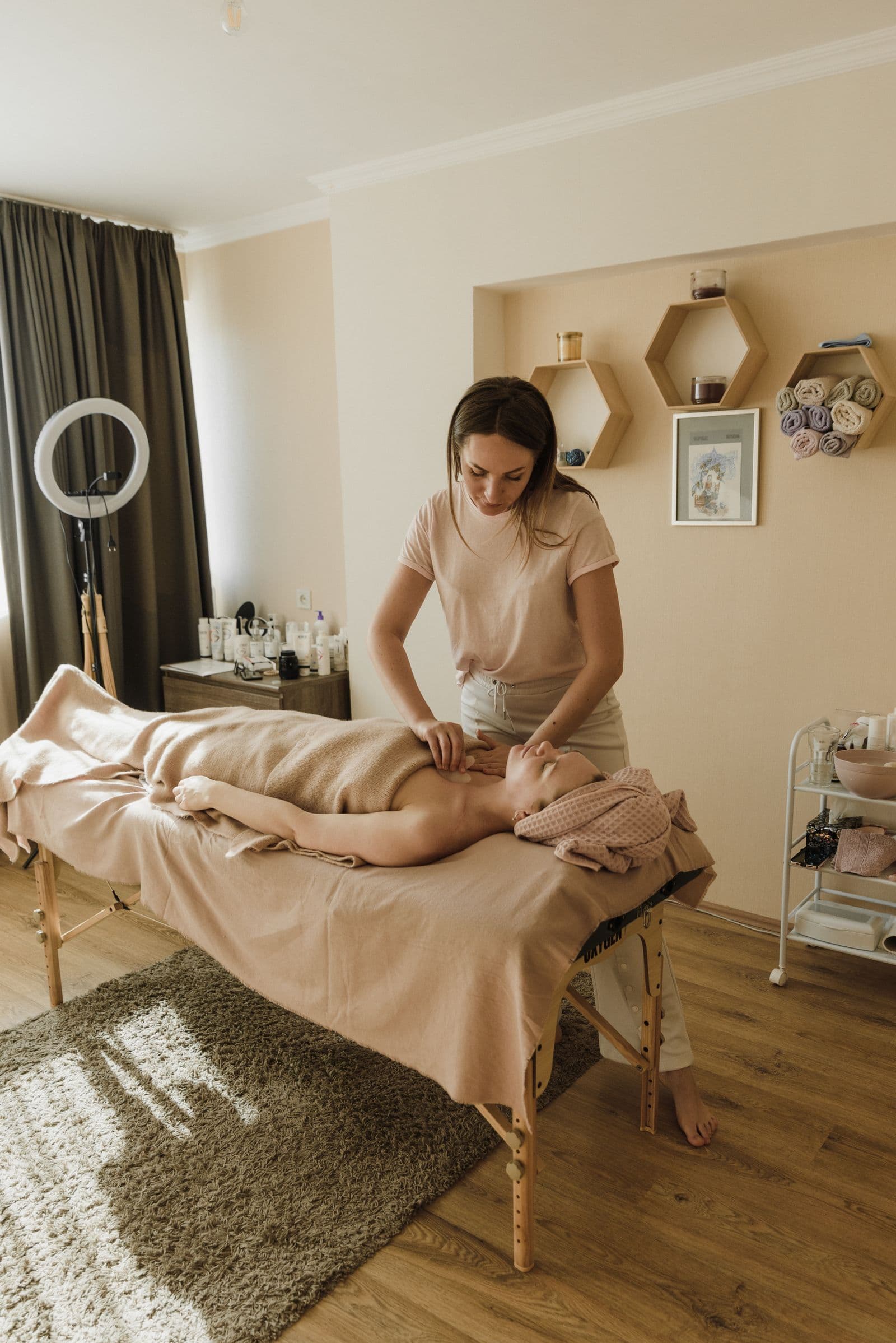 Therapist treating a client in a calm clinic room
